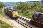 CSX 9992, with eastbound 892-04 meets, and passes CSX Q137 with CSX 7654 leading at Salisbury Jct, Pennsylvania. June 5, 2002.  
